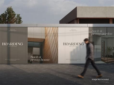 Outdoor construction hoarding mockup on a street wall with a passerby ...