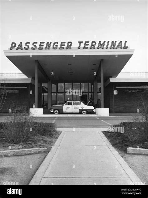 Denver, Colorado: c. 1954 A taxi cab at the entrance to the passenger terminal at Stapleton ...