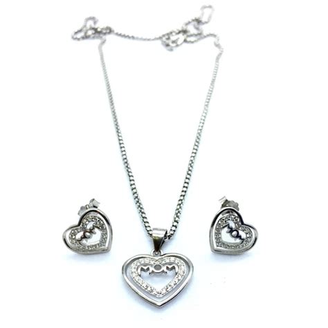 Cherish mom every day with this stunning heart necklace and earring set ...