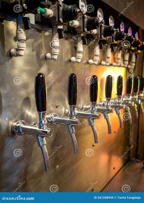 Row of Beer Tap Lines for Cold Draft Beer in Pub and Restaurant. Craft ...