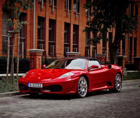 Download Stunning Red Ferrari F430 in Action Wallpaper | Wallpapers.com