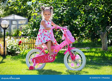 Cute Four-year Old Girl Riding Her Bicycle Stock Photo - Image of ...