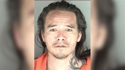 Suspect in stand-off charged with murder in mother's death