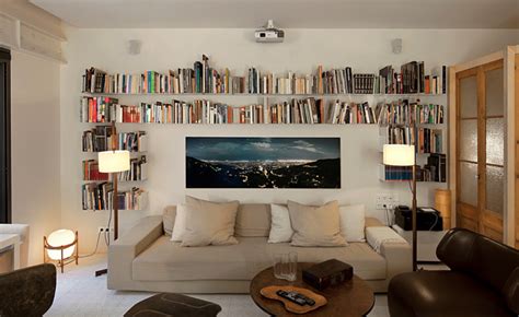 Bookshelf that wraps around sofa, allowing you to place sofa against ...