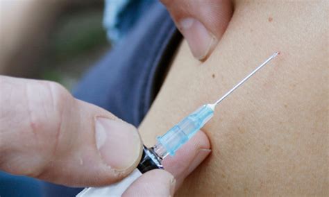 Give schoolboys HPV vaccine, says charity | Society | The Guardian