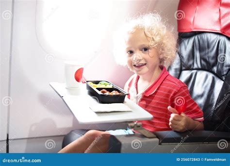 Child in Airplane. Kids Fly. Children Flight Meal Stock Image - Image ...