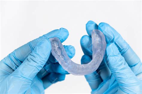 Premium Photo | Dental transparent plastic mouthguard splint for the ...
