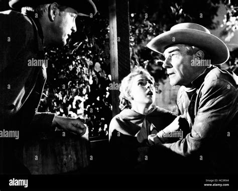 RAGE AT DAWN, from left: Forrest Tucker, Mala Powers, Randolph Scott ...