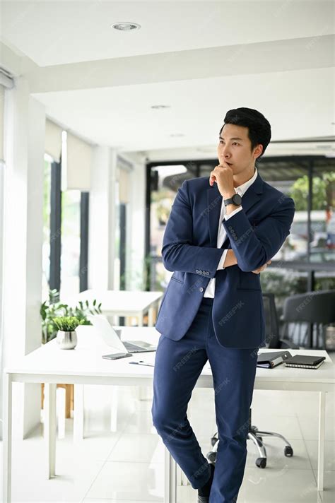 Premium Photo | A handsome smart millennial asian male ceo in a ...