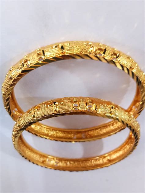 Buy Gold Enamel Base Metal Cat's Eye Traditional Bangle Set of 2 at ...