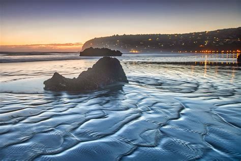 https://img.locationscout.net/images/2021-01/rock-sunrise-at-sumner-beach-christchurch-new-zealand_l.jpg