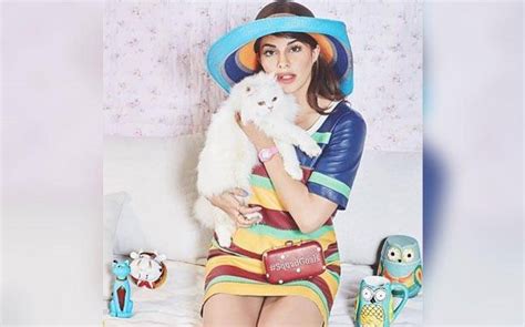 Jacqueline Fernandez cosies up to her cat Miu Miu for Cosmopolitan's ...