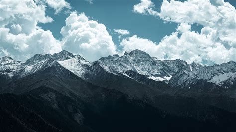 Download wallpaper 1366x768 mountains, peaks, clouds, snowy, landscape ...