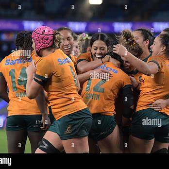 Women rugby players celebrating during a match