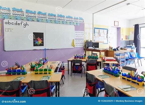 Empty Classroom in Elementary School with Whiteboard and Desks Stock ...