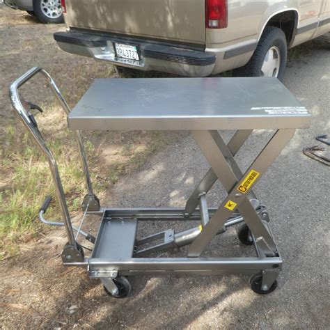 Lot # 101 - Haul Master Hydraulic Table Cart - 1000 LB Capacity ...