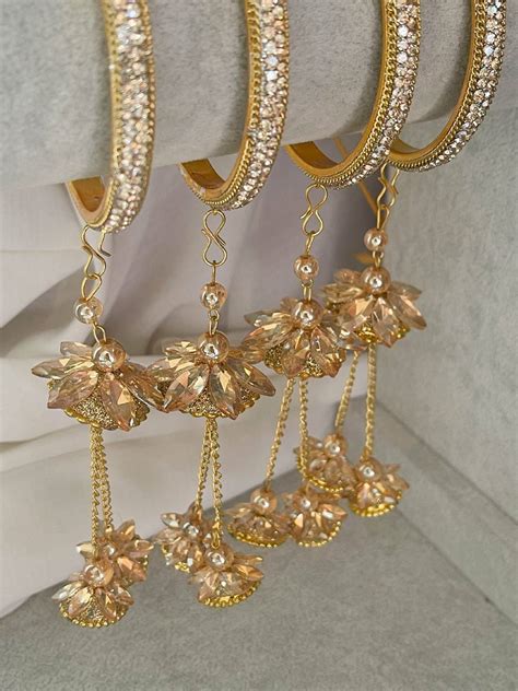Buy Antique Gold Stone Bangles With Floral Jhumka Online - Ishhaara