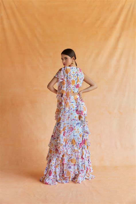 White chintz printed ruffle saree with cut out blouse