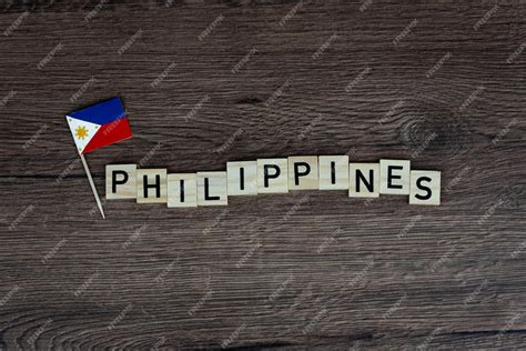 Premium Photo | Philippines - wooden word with philippine flag (wooden ...