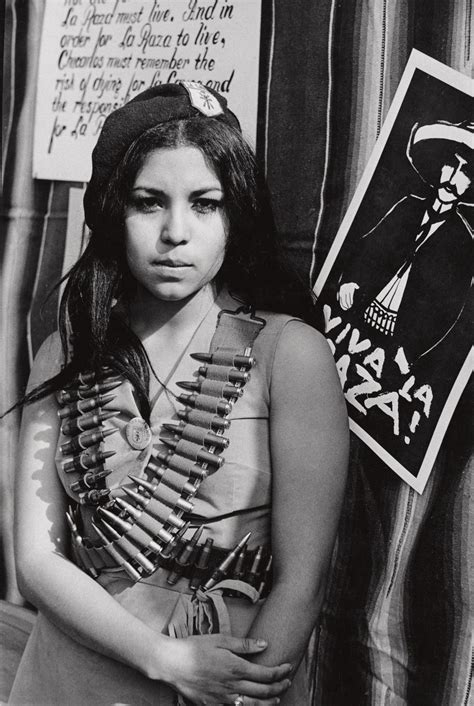 A woman in Las Adelitas de Aztlán, a women's organization that ...