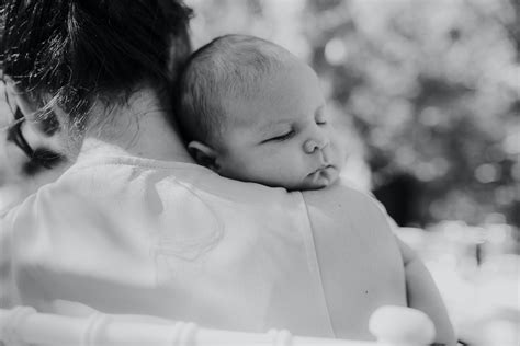 Black and White Photo of a Woman Holding a Baby · Free Stock Photo