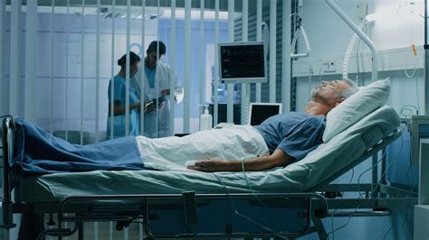 Sick Person In Hospital Bed