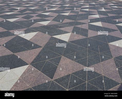 The square is paved with triangular tiles. Grey, white, black tiles on ...