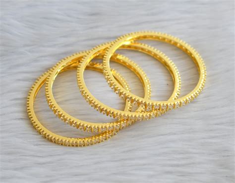 Gold tone cz white square stone set of 4 bangles(2.10) dj-45626 ...