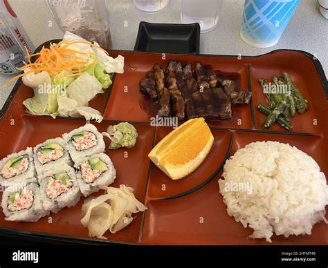 Lunch bento box with sushi, beef teriyaki, rice, and salad at Kiawa ...