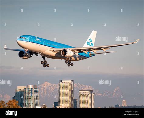 An aerial view of KLM A330-200 arriving at YVR during golden hour Stock ...