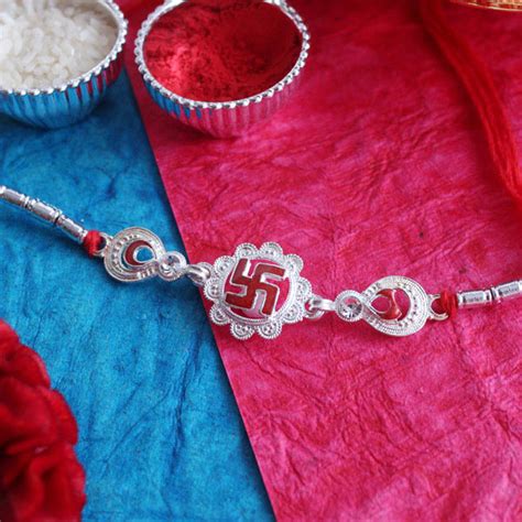 Send Brilliant Swastika Silver Rakhi Online | Rakhibazaar.com