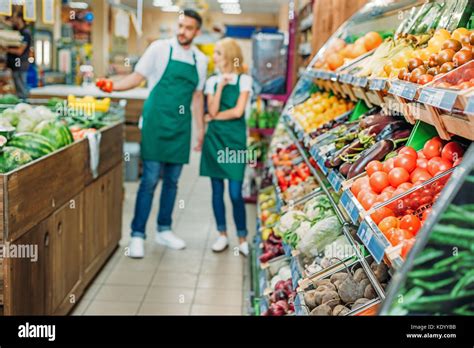 shop assistants in supermarket Stock Photo - Alamy