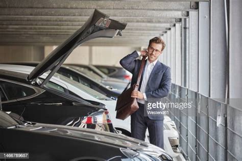 Man in a Business Suit in a Mall Parking Lot 的图像结果