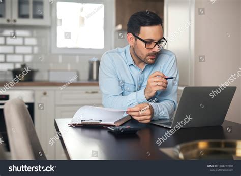 Young Accountant Work Home Looking Laptop Stock Photo 1704723910 | Shutterstock