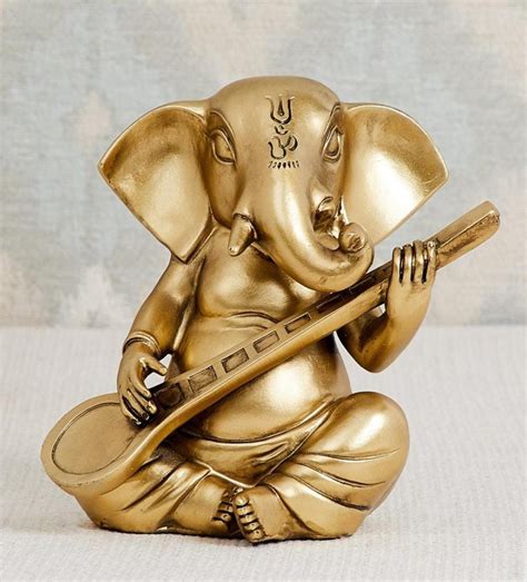 Buy Golden Ganesha Playing Sitar Table Decor Showpiece online at ...