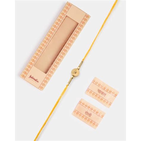 Buy Fabindia Yellow Metal Thread Rakhi with Roli Chawal Online