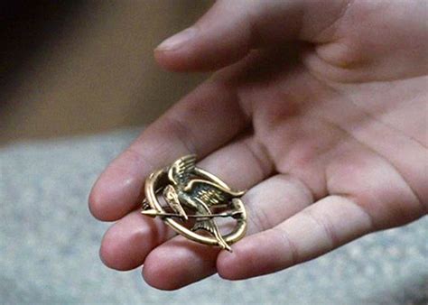 The Hunger Games Jewelry Designer Explains Mockingjay Pin Design ...