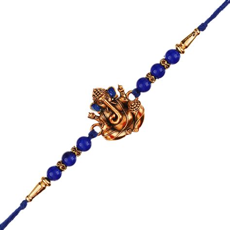 Golden Lord Ganesha Blue Pearl Rakhi and Roli Chawal Pack - eCraftIndia ...