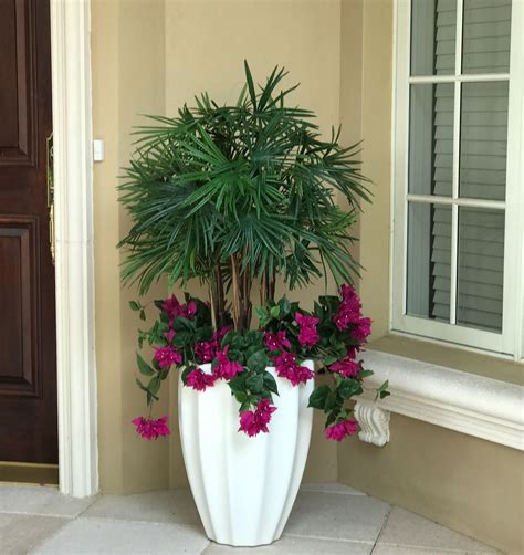 A permanent botanical Lady Finger palm underplanted with outdoor silk ...