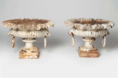 Pair Of 19th Century French Lion Head Urns in Antique Planters