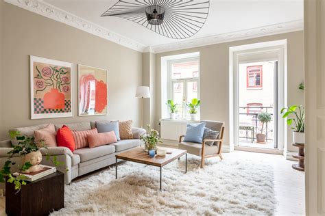 A beige wall color, bright accents, and light grey kitchen cabinets ...