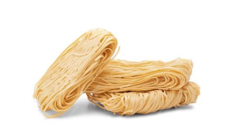 Premium Photo | Dry strips of egg noodles (pasta nests) isolated on white background.