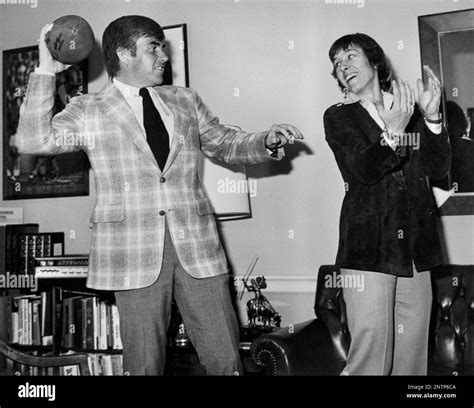 Representative Jack Kemp of the Buffalo Bills plays catch with tennis ...