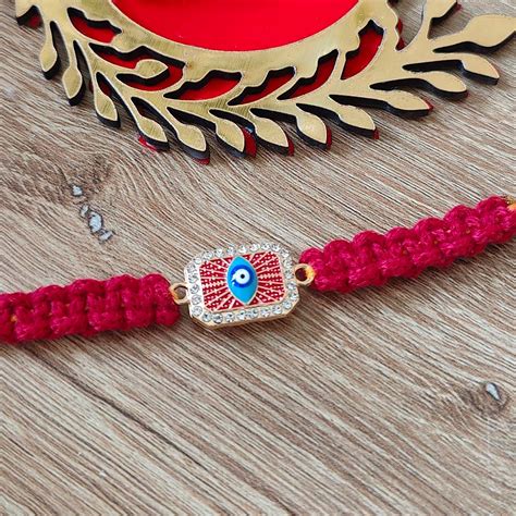 Buy Handmade Macrame Brown Evil Eye Metal Rakhi With Roli Chawal Online ...
