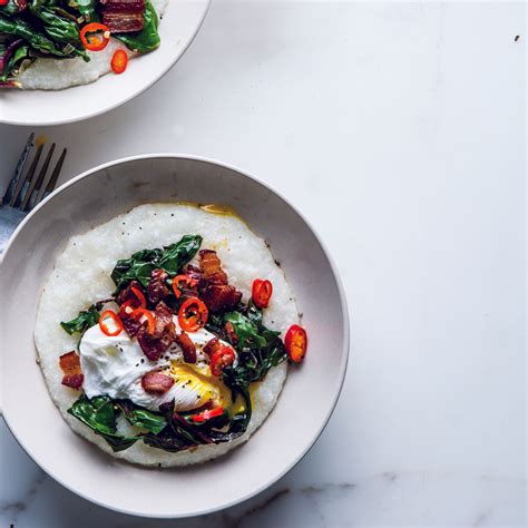 Cheesy Grits With Poached Eggs, Greens, and Bacon Recipe | Epicurious