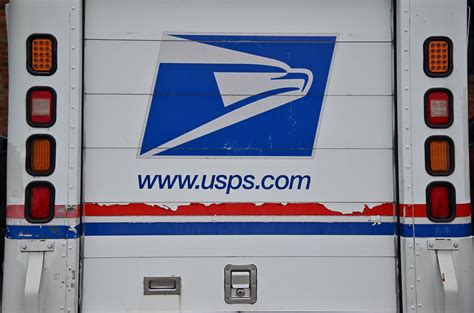 U.S. Postal Service (USPS) trucks are parked at a post office on August 23, 2024 in Glendale, Califo