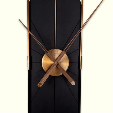 Shop Black Vertical Capsule Wall Clock with Golden Metal Frame