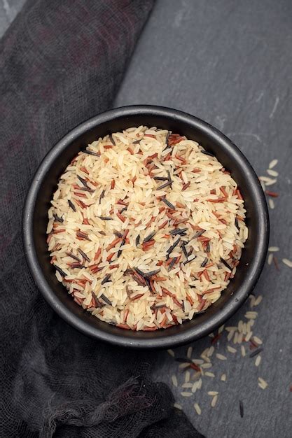 Mix of rice in small black bowl | Premium Photo