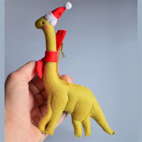 Dinos are very popular now. Why not to make one for Xmas : r/CraftsProjects