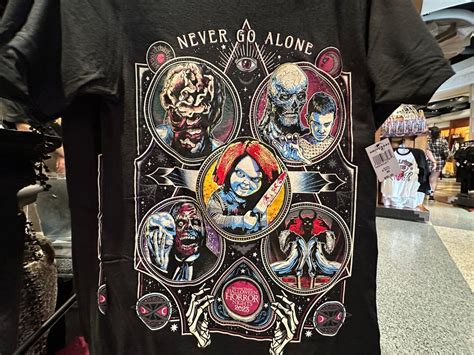Halloween Horror Nights merchandise never go alone display - MiceChat